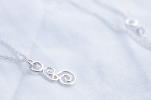 Swirls necklace on silver chain