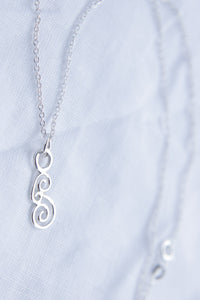 Swirls necklace on silver chain